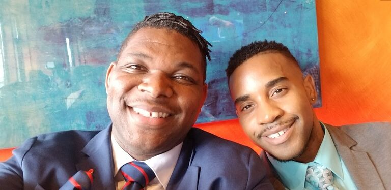 Darrell had recently moved to Omaha, NE to begin his role as Associate Conference Minister.  He reached out to a number of community leaders to inquire about potential partnerships and connections. Kentavis who is a MixxedFit master educator was amenable to a meet up about potentially offering a Gospel dance fitness class. They both met at LIV Lounge in Aksarben near Darrell's house. After Kentavis' final arrival (45 mins. late) the two hit it off smashingly. Darrell and Kenny both shared their love of God, all things church, and they both had an openness to a new and exciting friendship. They shut the lounge down after a three hour conversation. Kenny left with a commitment to visit some churches with Darrell in his new role, and Darrell left boldly asking Kentavis for a goodbye kiss, which he obliged to give a few times. 