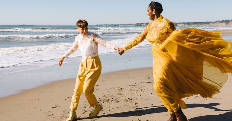 couple holding hands amid planning a wedding step by step