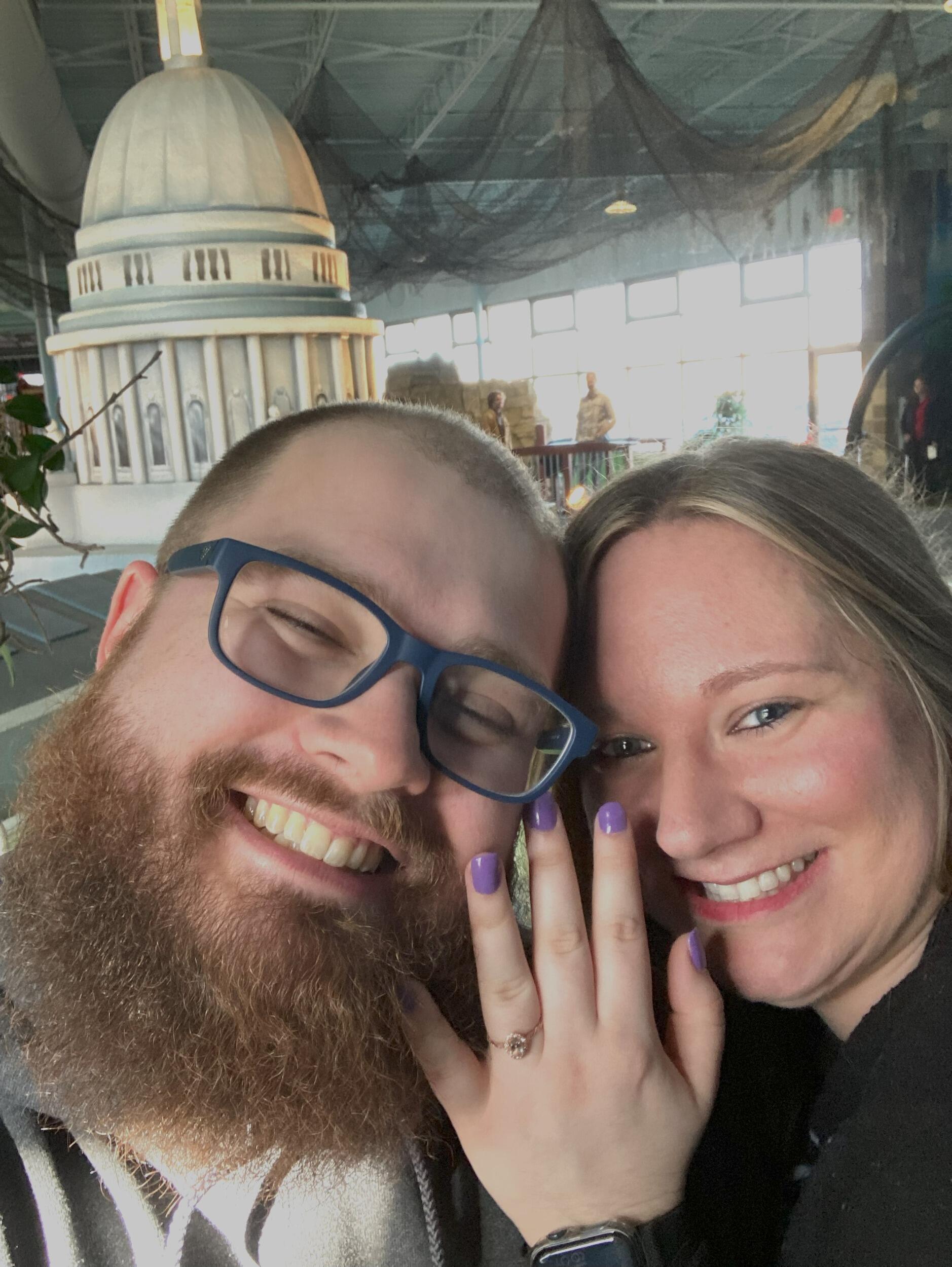 Five years to the day of their first date, Reese planned a mini-golf date at Vitense. He insisted they each wear what they wore on their first date; for Reese a UW- Platteville sweatshirt and for Morgan a 'Just a Small Town Girl' sweater.