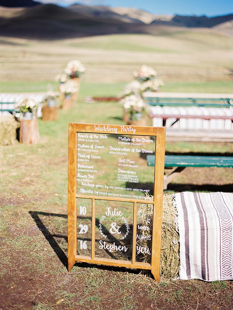 Rustic wedding ceremony sign with the wedding party names