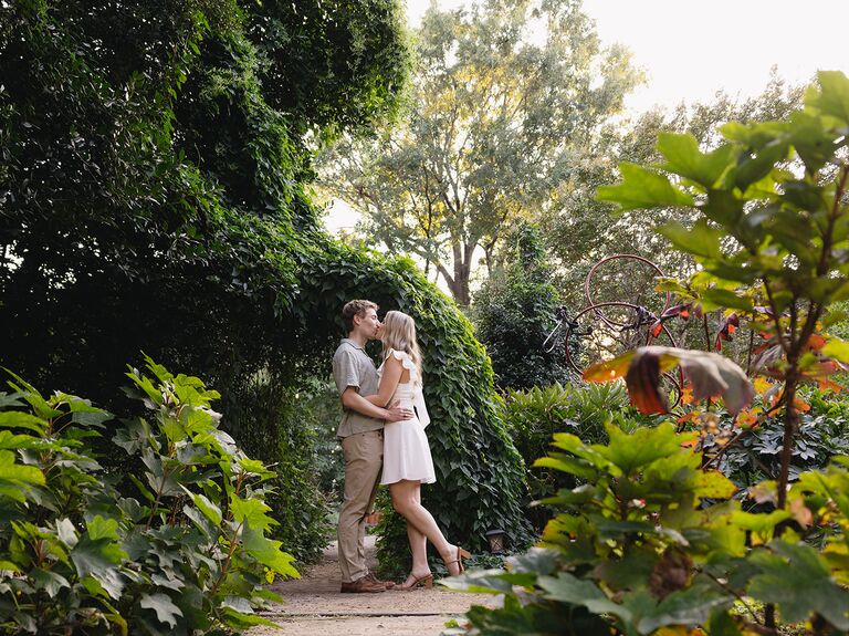 Engagement photo taken in McGill Rose Garden in Charlotte, NC