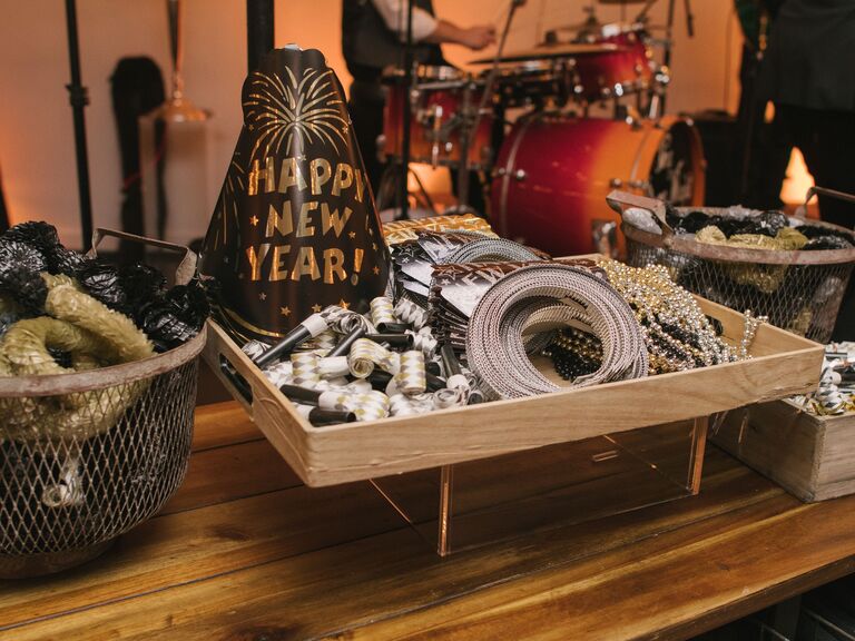 new year's eve wedding favors station with hats, noisemakers and bead necklaces
