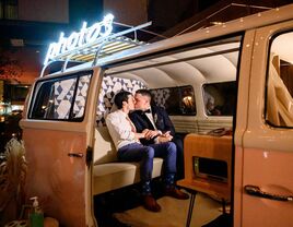 Couple kissing in vintage van photo booth