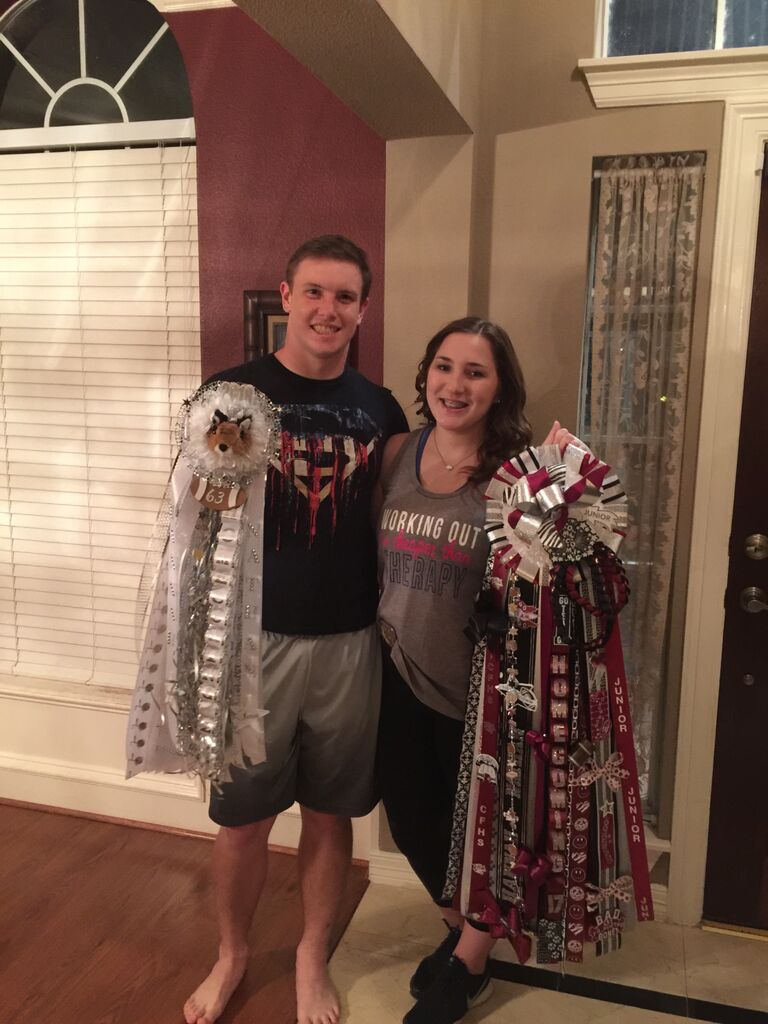 The first time to receive a mum and garter for homecoming which is a HUGE Texas tradition
