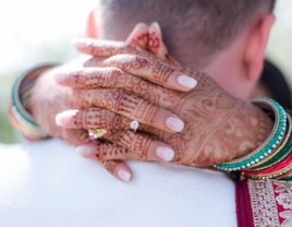 Close up of bride's hands and engagement ring