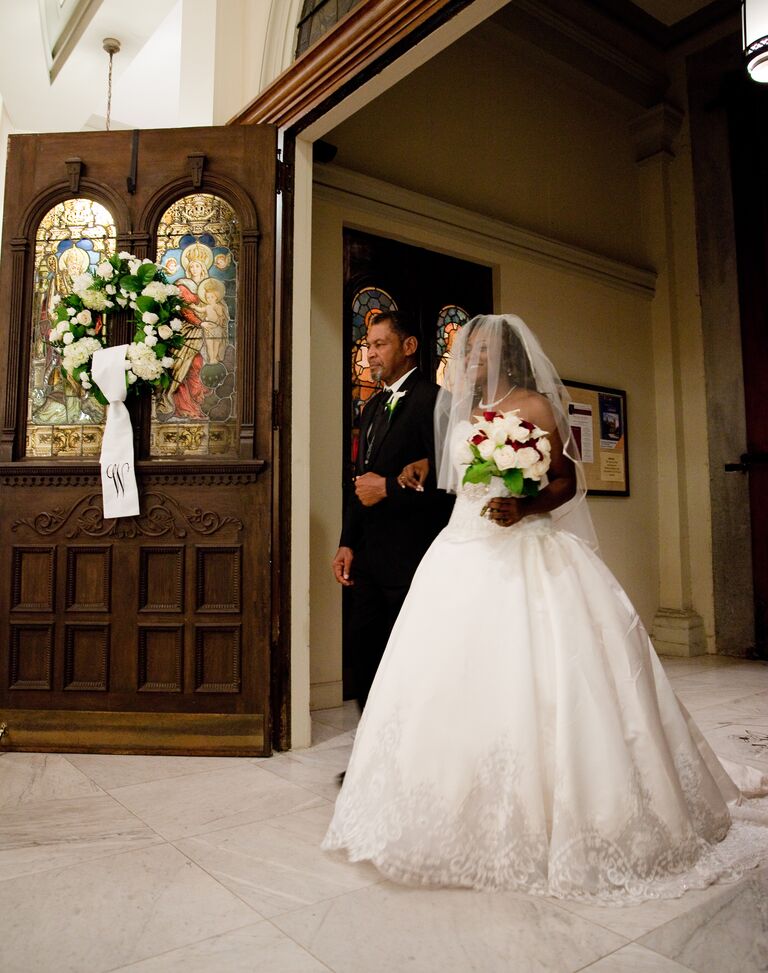 Father and daughter before they walk down the church aisle at the wedding ceremony