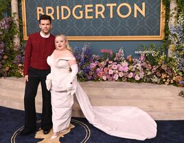 Luke Newton and Nicola Coughlan posing at the Bridgerton premiere