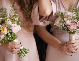 Closeup of two bridesmaids holding wedding flowers