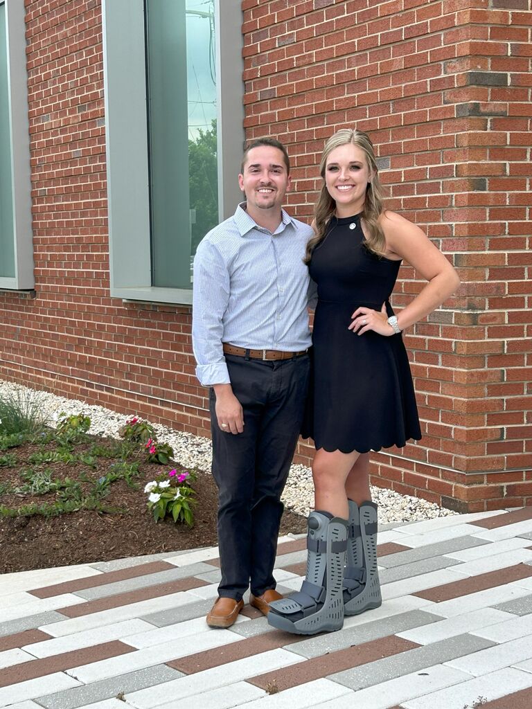 Julia's graduation from Central Piedmont's Community Colleges Physical Therapist Assistant Program! (With the fashion statement of the year... two boots recovering from broken ankles)