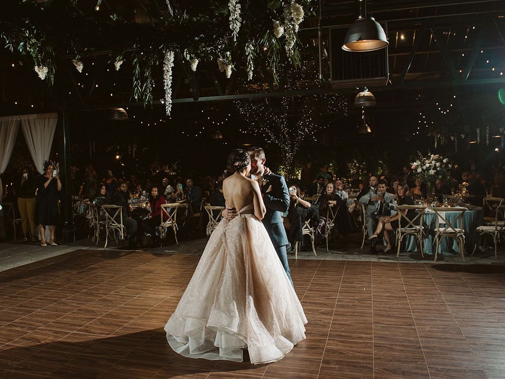 Bride and groom during first dance at wedding reception