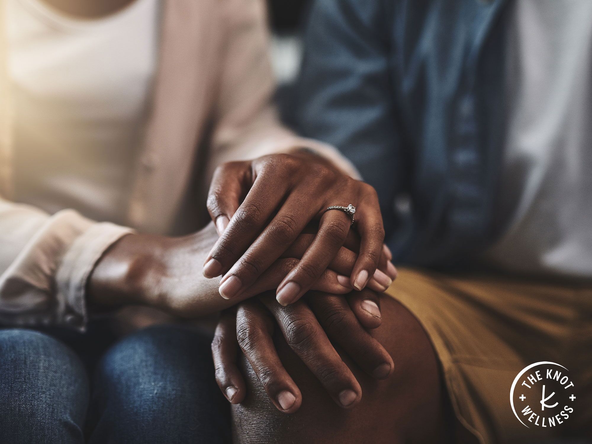 Close-up of couple interlocking hands 
