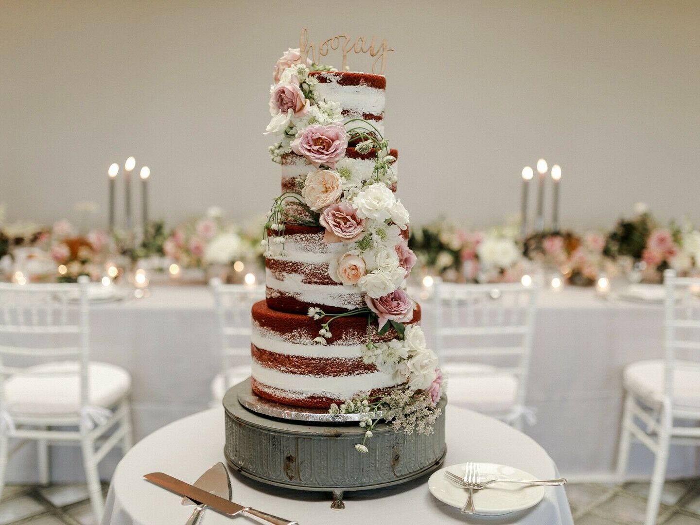 four tier semi naked wedding cake with chocolate sponge, pink and ivory roses and queen anne's lace