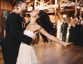 Happy couple dancing at their wedding reception