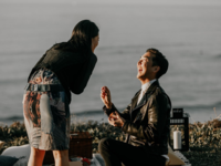 Man proposing to woman on a san diego beach