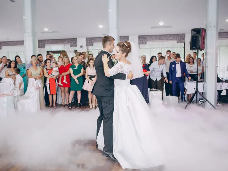 Bride and groom's first dance on foggy dance floor with dance lessons by Librero's School & Dance Club in Tampa, Florida