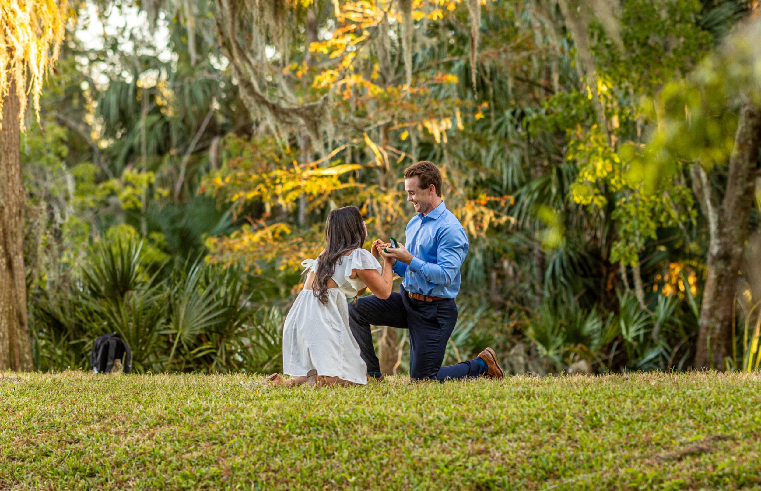 This photo was taken during what Olivia thought were just her family Christmas card pictures. But Connor had something much more special planned. In the middle of the shoot, he got down on one knee and asked Olivia to marry him—and she said yes! Completely surprised and overjoyed, Olivia was even more touched to find both of their families waiting to celebrate over dinner that evening. It was the easiest yes, and the beginning of forever.