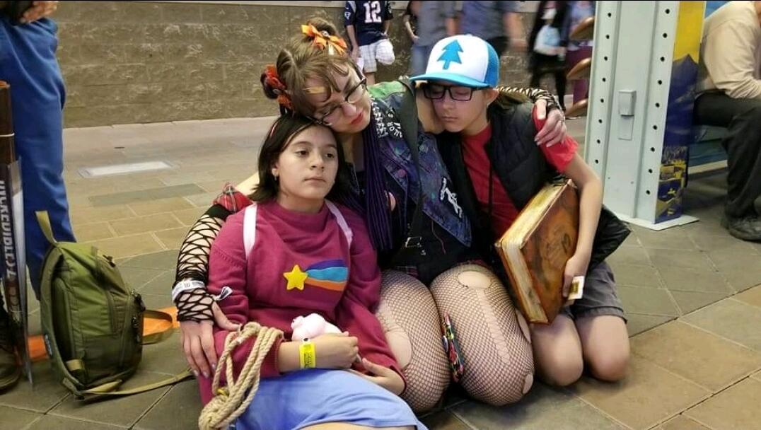 These cubs & their Momma Bear are pooped. Waiting for the Light Rail after a long day at Phoenix Fan Fusion