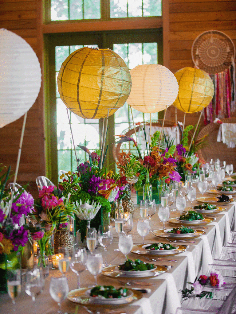 White and gold suspended paper lantern centerpieces. 