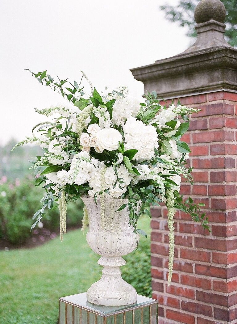 Romantic white floral arrangement in urn