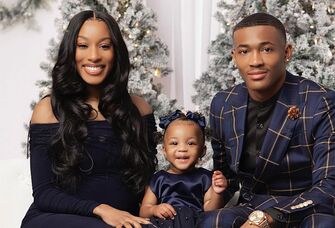 Devonta Smith with fiancee Mya Danielle and their child