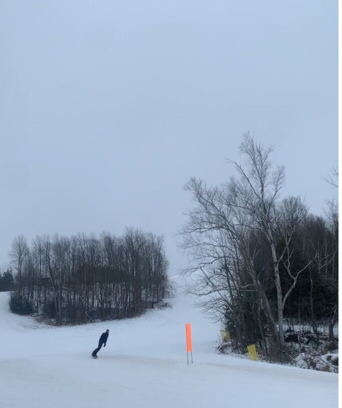 Josh snowboarding in Canada during our winter road trip. 