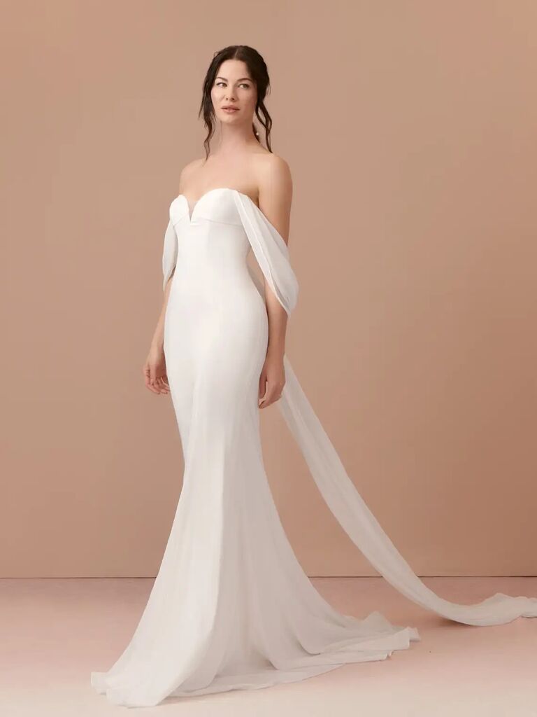 Strapless affordable wedding dress with a train by Azazie. 