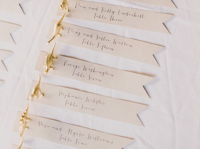 Golden dinosaur wedding escort cards
