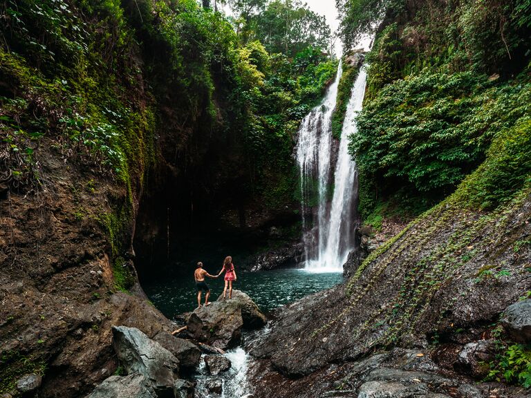 Couple near waterfall in Bali