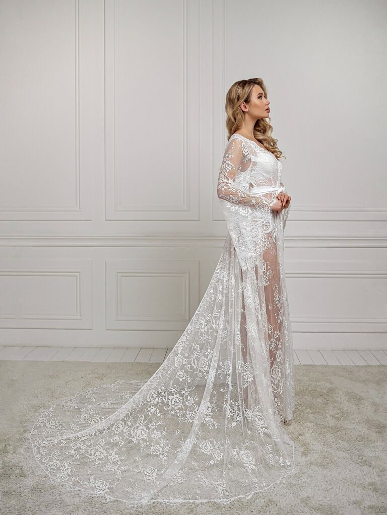Model wearing long lace bridal robe