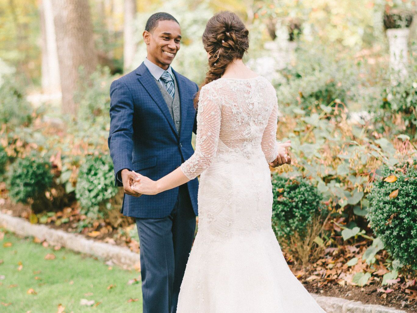 Bride and groom holding hands