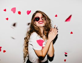 Woman with heart confetti 