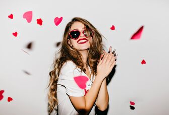 Woman with heart confetti 