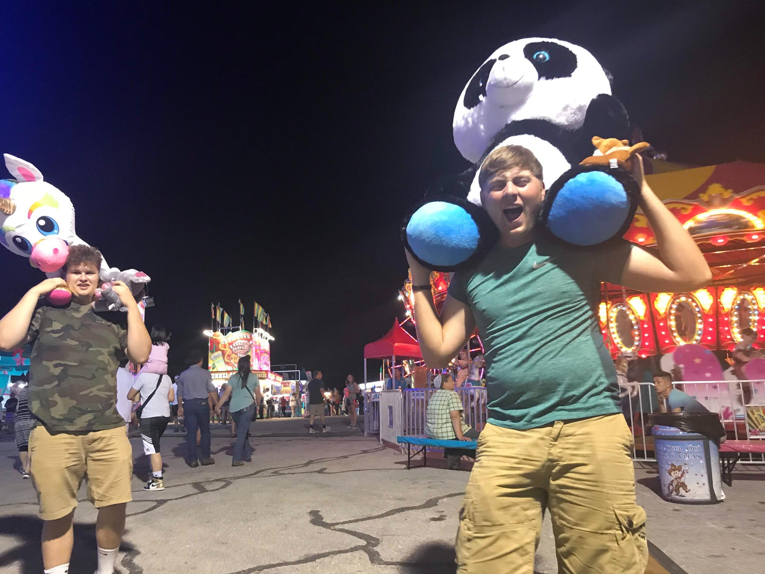 WE LOVE FAIRS! Tommy always wins the huge stuffed animals at the basketball hoops (that are nearly impossible)