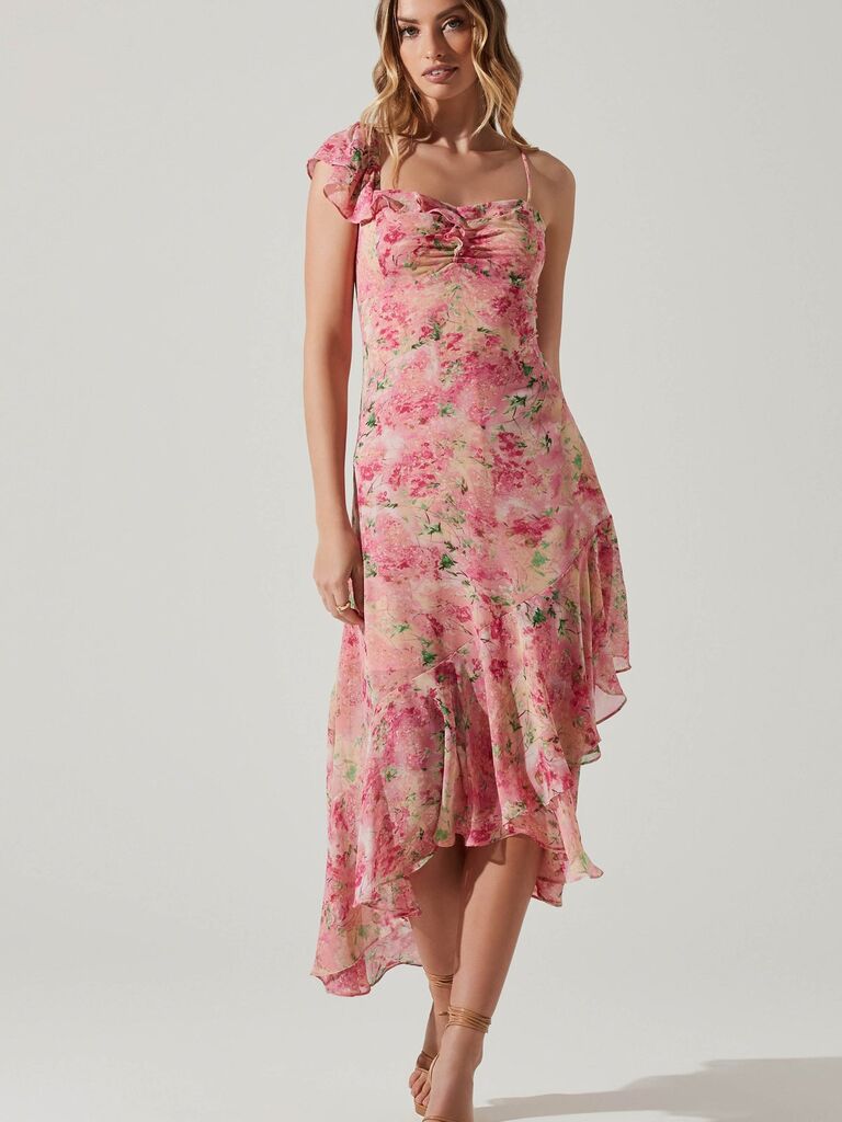 A pink floral asymmetric ruffled hem midi dress with one ruffled sleeve strap from ASTR The Label