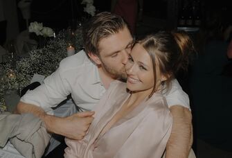 Leon Draisaitl kissing his wife Celeste on the cheek