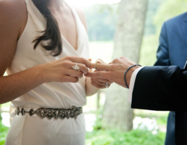 Couple exchanging rings on wedding day