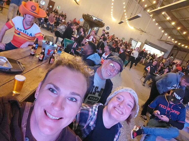 Justine, Tori, and Tori's dad Dave watch the Astros in the World Series at St Arnold's Brewing Company