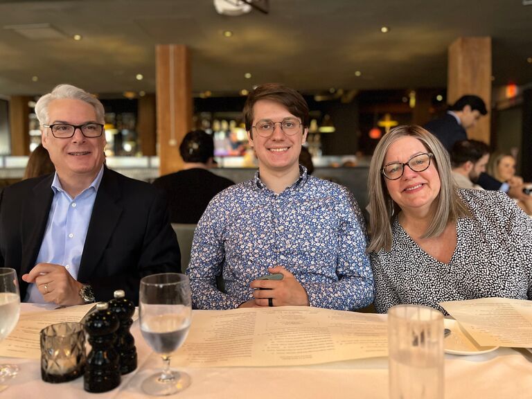 Griffen with his parents celebrating his success. 