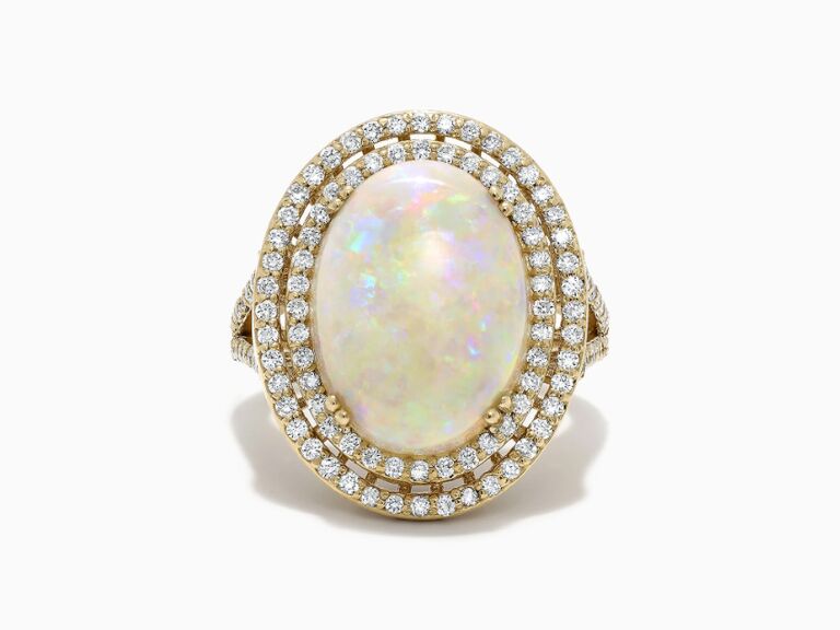 Opal engagement ring on split shank band with double diamond halo