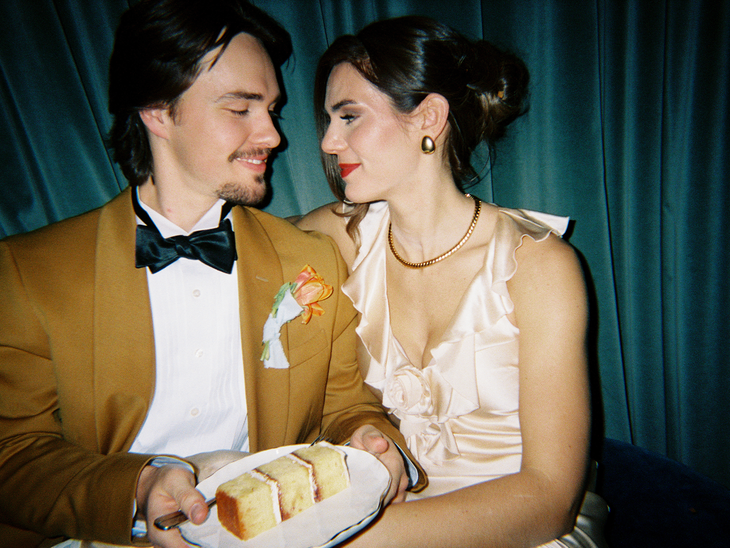 bride and groom with wedding cake