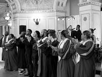 Gospel choir singing and clapping at reception