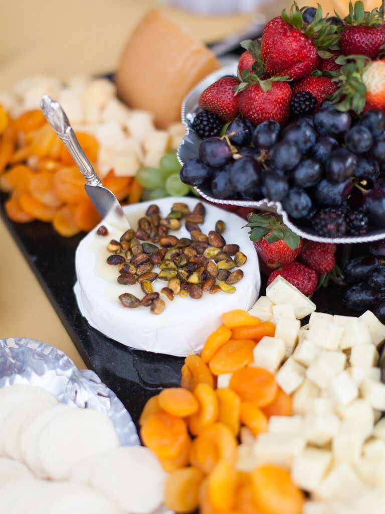 Fruit and cheese tray grazing table at wedding