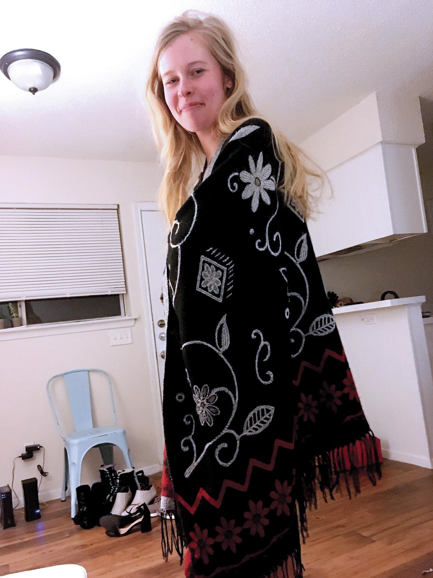 SIMPLY AT EASE. Just over a month after their first kiss, Derek captures this photo of Emily, simply at ease, modeling her “AC shawl.” He already knows they will have a “good shot of doing well together, if we play our cards right.”