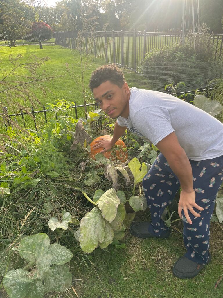Zach grew a HUGE pumpkin in his Garden! 