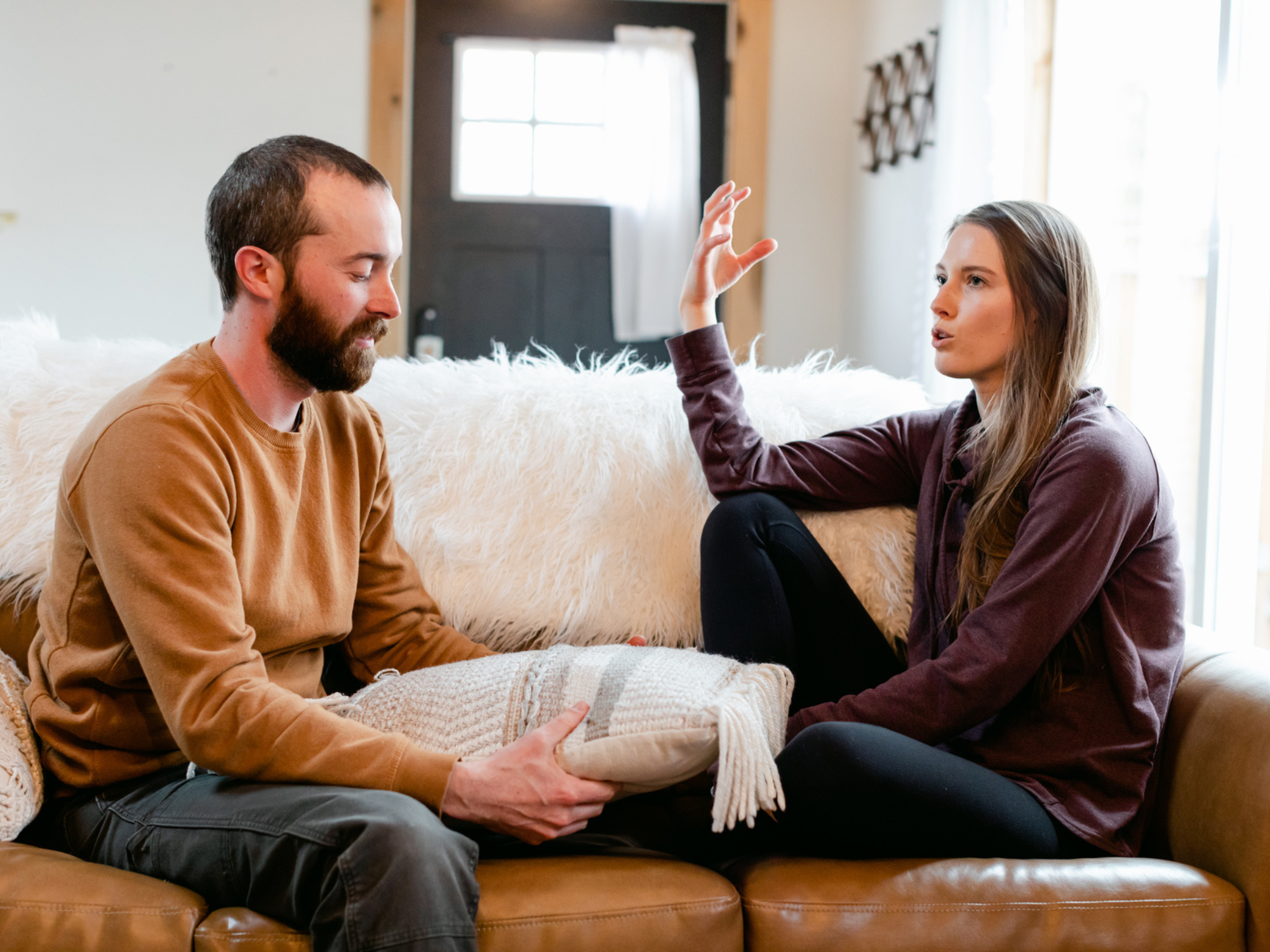 Couple having conversation on couch