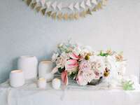 pale pink centerpiece with modern white candles