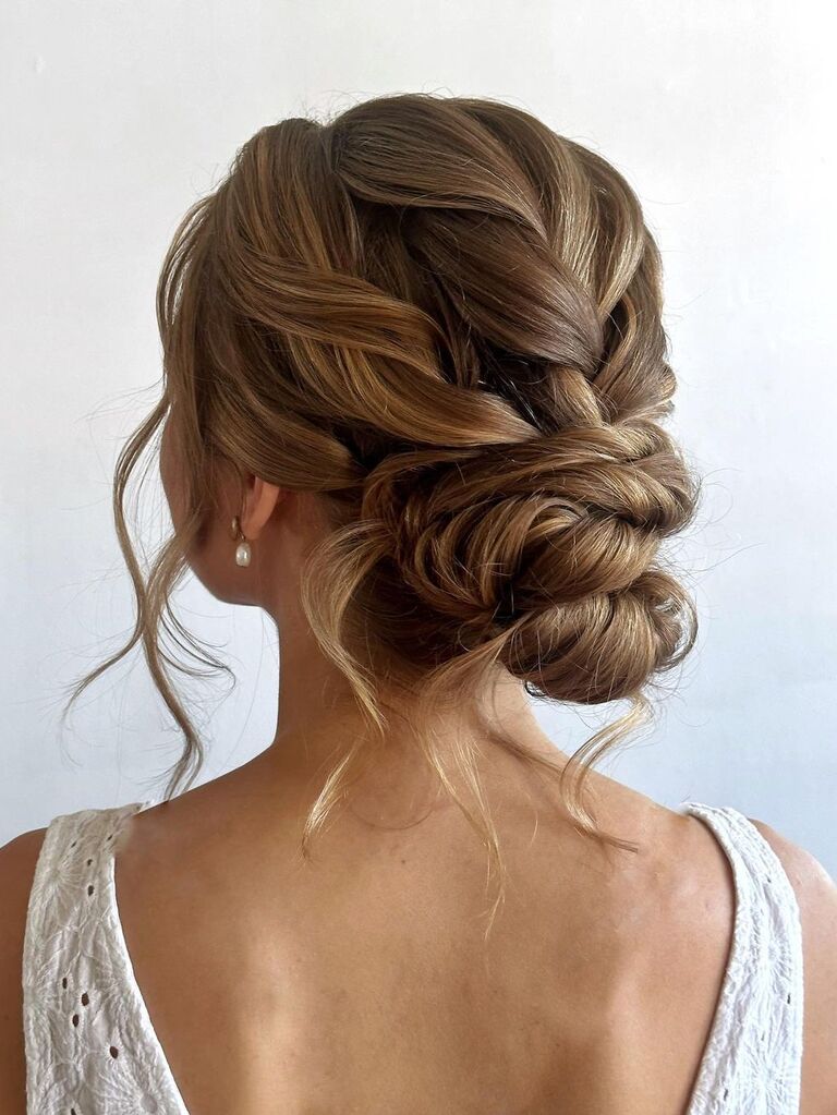 Loose braided chignon wedding updo for long hair