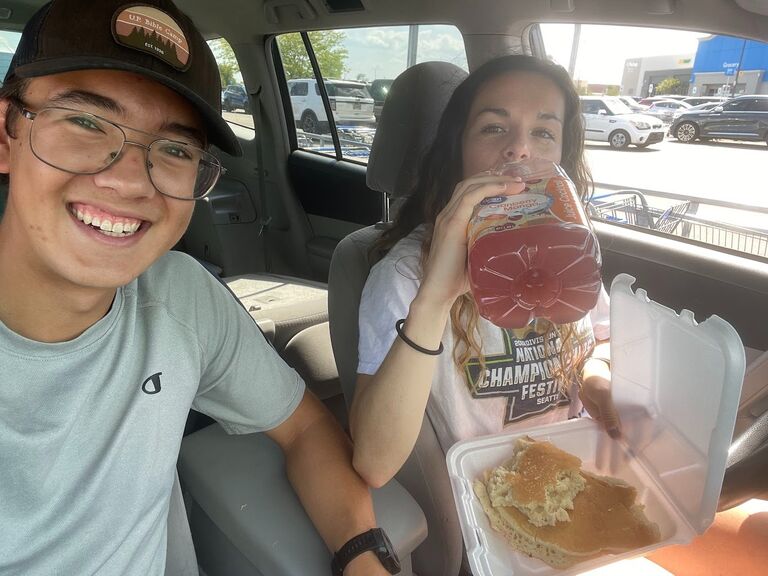 Bethany: Since there's nothing to do in Ohio, Caleb and I would sometimes go to Walmart for fun (one time we even got to witness a fight). 
This picture was taken after we bought some juice from Walmart and Caleb gave me his extra pancake after completing the Clifton Mill Pancake Challenge 