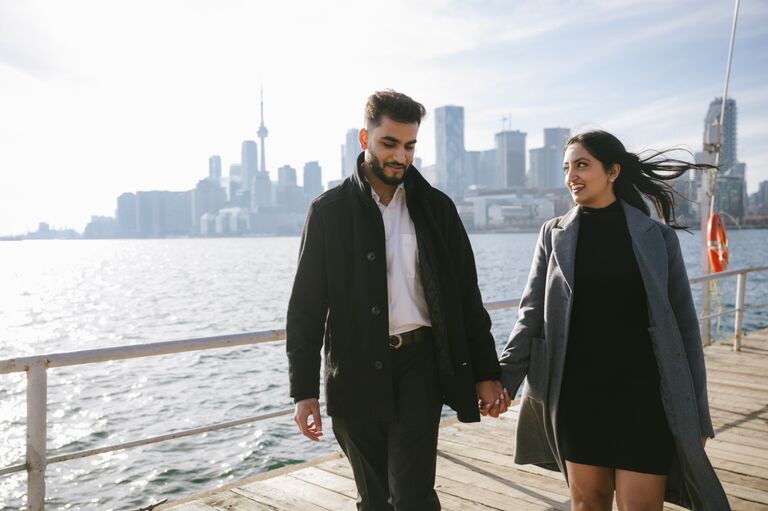 The Proposal - After our Roka, it was my turn to plan the perfect proposal. The only problem? My Type-A fiancée has an ability to predict my every move. Keeping it a secret was nearly impossible.

But somehow, I pulled it off.

With her favorite song playing in the background and the city skyline reflecting off the water, I finally got down on one knee. And in that perfect moment, she said YES!