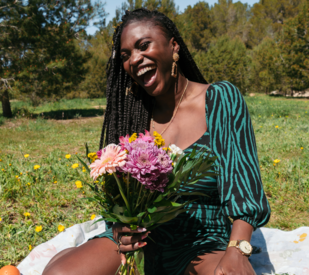 Woman holding a fresh bouquet of wild flowers